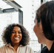 couple closing real estate contract with real estate agent